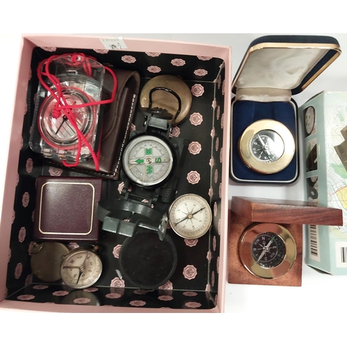 206 - A collection of vintage and later compasses, some military style