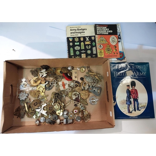 262 - A collection of various military badges and buttons etc