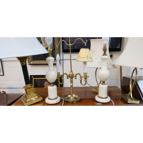 115 - A pair of marble desk lamps in the traditional manner; a brass lamp traditional style  and another.