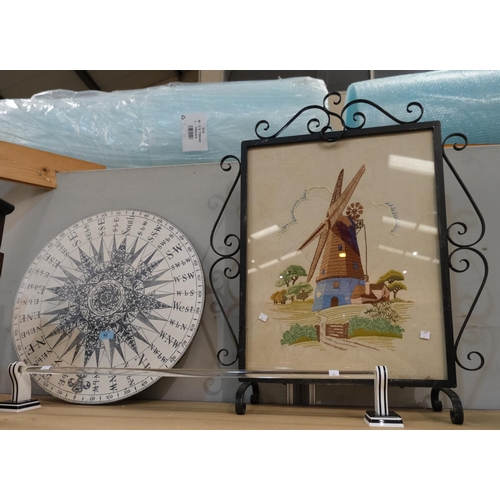 62 - A FORNASETTI style circular compass coffee table top, 52cm; a perspex towel rail and a wrought iron ... 