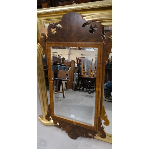 911 - A Chippendale style mirror and a side table with two drawers and a nest of tables.