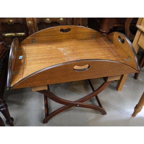 922 - A mahogany butlers tray table with drop sides and stand.