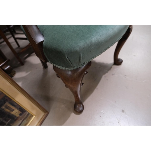 924 - A mahogany Georgian armchair with rams head armrests, cabriole legs and lyre shaped back, and a foot... 