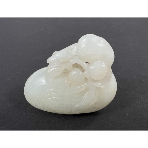 581B - A Chinese carved jade coloured hard stone bird eating fruit with detailed decoration length 5.5cm