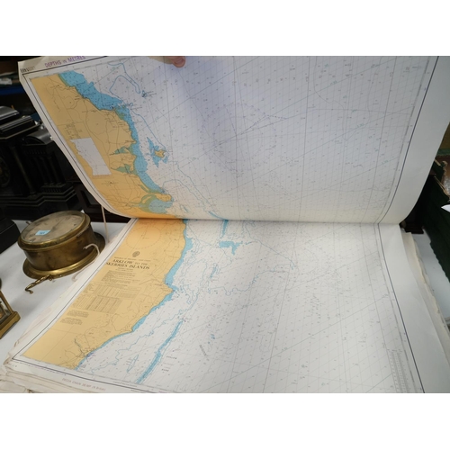 143 - Two folios of maritime charts of the coast round Britain.