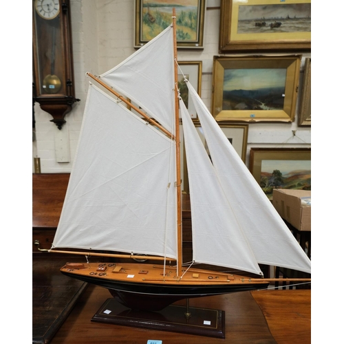 177 - A wooden model of a yacht in full sale, length 80cm x height 84cm