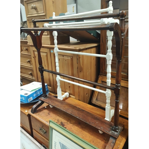 870 - Two oak bedside pot cupboards, a mahogany towel rail and a painted towel rail.