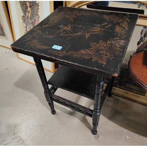 877 - A Japanese-style two-tier ebonised table with gilt decoration of birds on branches; an oak arm chair... 