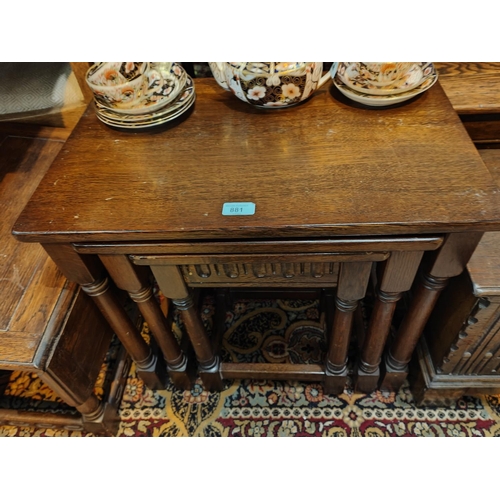 881 - An oak nest of three occasion tables and an occasion drop leaf table and a card table trolley.