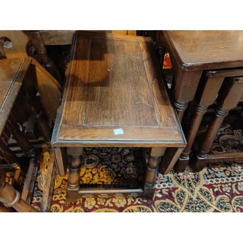 881 - An oak nest of three occasion tables and an occasion drop leaf table and a card table trolley.