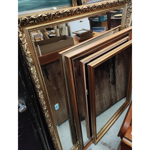 886 - A large gilt framed oval mantel mirror, 100 x 74cm; another similar and various mirrors.