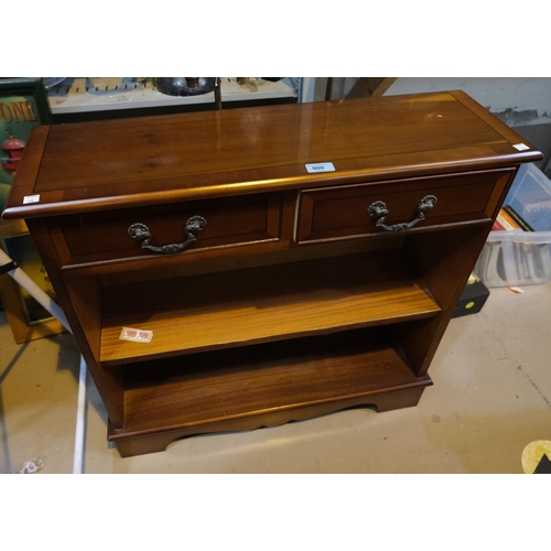 900 - A reproduction yew-wood dwarf bookcase with two drawers and two shelves.