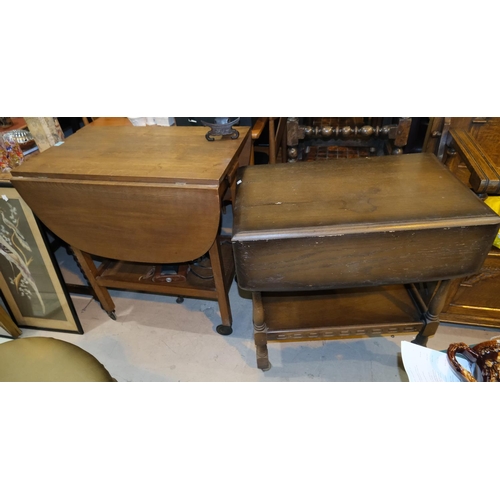 933 - An oak 1930's drop leaf drinks trolley and another similar.No bids sold with next lot