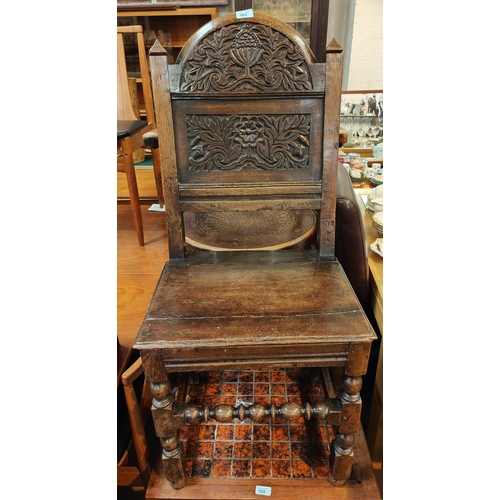 984 - A late 17th/early 18th century North Country chair with carved back panel and pyramid finial, solid ... 