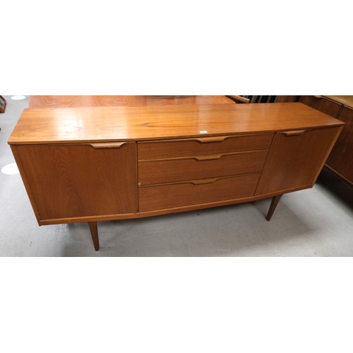 897 - A mid 20th Century teak long low sideboard with three central drawers and cupboard to each end.184 x... 