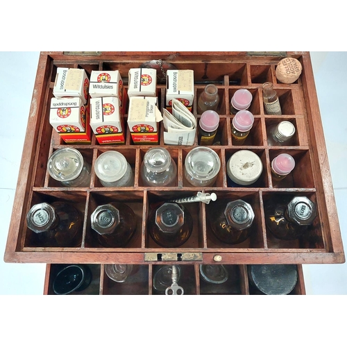 187A - A 19th century wooden apothecaries chest with later vintage glass medical bottles bottles, pestle an... 