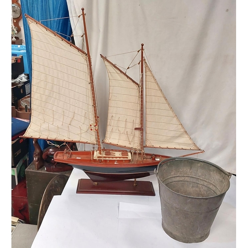 90A - A fire bucket and a model of a boat