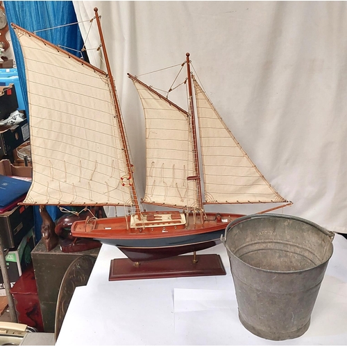 90A - A fire bucket and a model of a boat