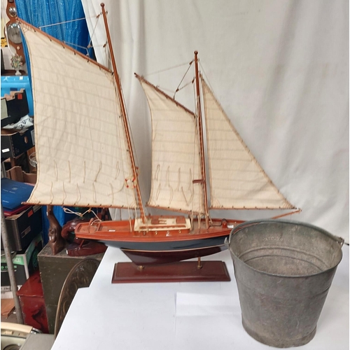 90A - A fire bucket and a model of a boat