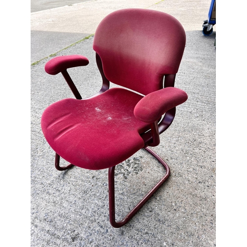 950 - A set of five tubular office armchairs in red by Herman Miller.