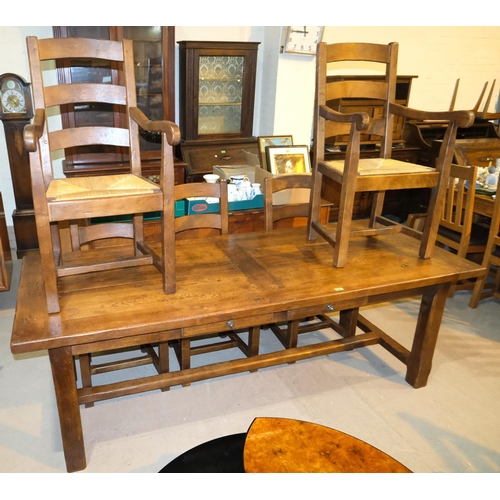 1018 - A period style oak dining suite comprising large refectory table, length 220cm and 6 (4+2) ladder ba... 