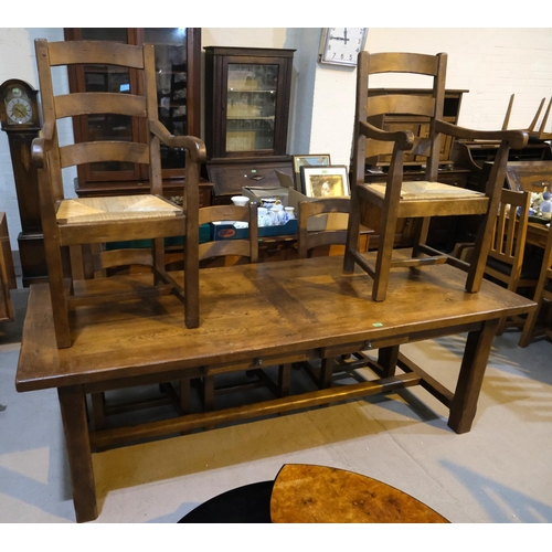 1018 - A period style oak dining suite comprising large refectory table, length 220cm and 6 (4+2) ladder ba... 