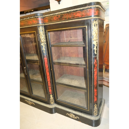 1024 - A large 19th Century ebonised credenza with boule work, brass fittings, four glazed doors with brass... 