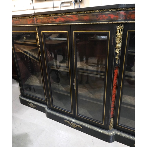 1024 - A large 19th Century ebonised credenza with boule work, brass fittings, four glazed doors with brass... 