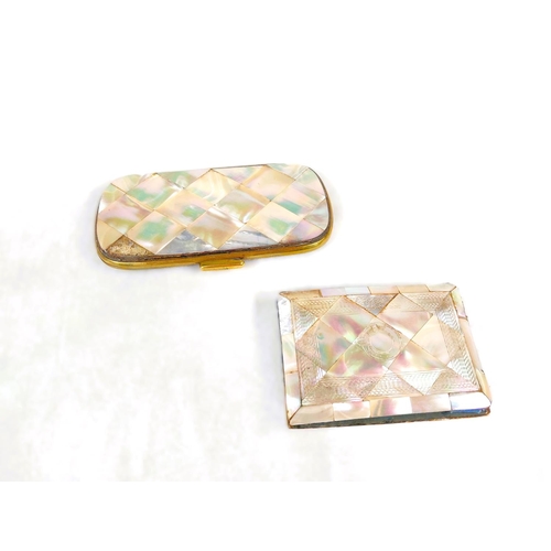 104 - A Victorian mother of pearl card case, 14cm and a similar with engraved decoration.