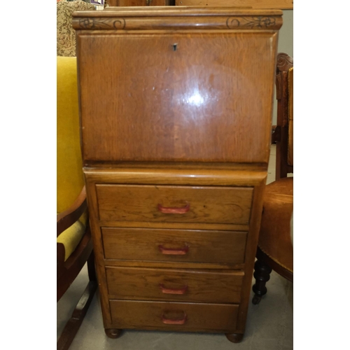 1041 - A 1930's oak Joseph Serlin fall front bureau of tall narrow proportions with composition handles.