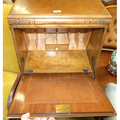 1041 - A 1930's oak Joseph Serlin fall front bureau of tall narrow proportions with composition handles.