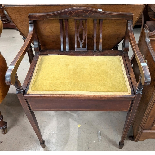 1043A - A mahogany inlaid piano stool, Edwardian.