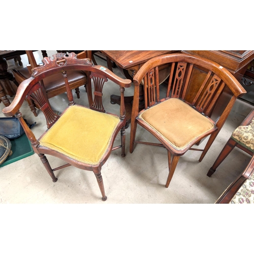 1044 - Two inlaid mahogany armchairs with pierced supports.