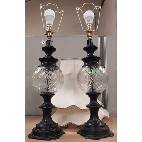 2 - A pair of cut glass and metal column lamps with cut glass reservoirs