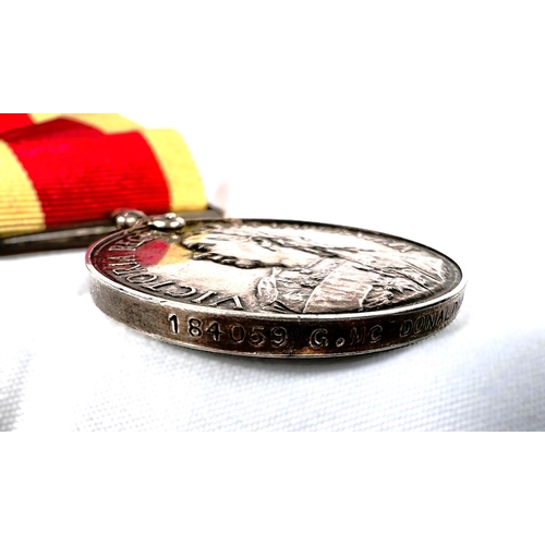 219 - A Queen Victoria China War Medal 1900 to 184059 G McDonald ABRN, no clasp.