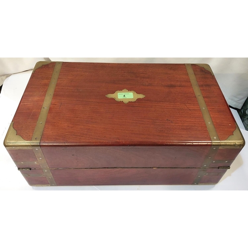 4 - A 19th century mahogany campaign writing desk with brass bindings, an ink well, fitted handles etc