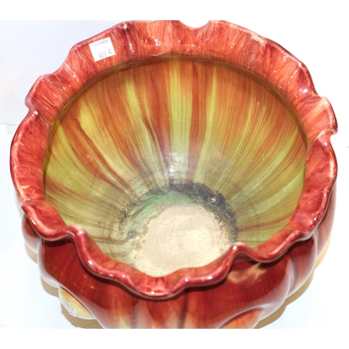 Bretby Art Pottery: - A circular jardiniere with folded rim & stylized ...