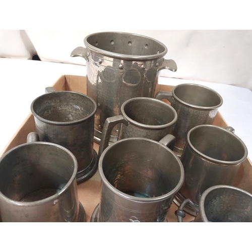 5 - A planished pewter siphon/bottle stand and 6 small pewter tankards, 3 with glass bottoms.