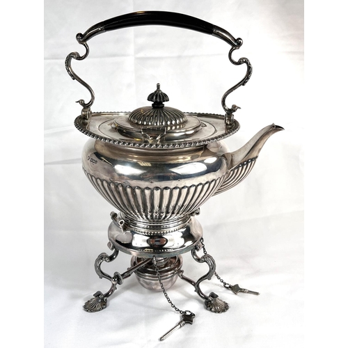 685 - A Georgian style spirit kettle of oval form with gadrooned rim and lower section, the burner base wi... 