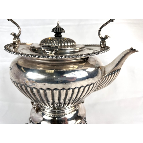 685 - A Georgian style spirit kettle of oval form with gadrooned rim and lower section, the burner base wi... 