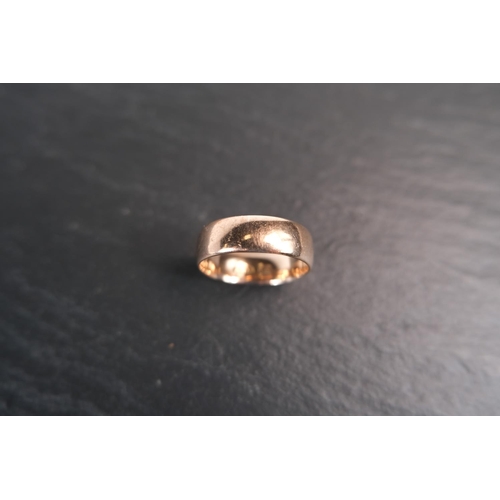 687 - A wide barrel shaped 9 ct hallmarked gold wedding ring, 4.4 gms, size 'P' - 'Q'.