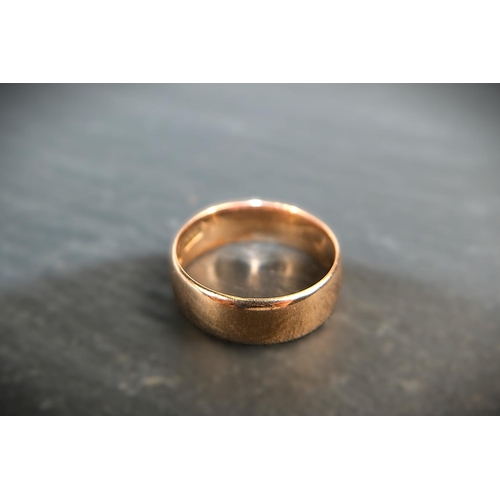 687 - A wide barrel shaped 9 ct hallmarked gold wedding ring, 4.4 gms, size 'P' - 'Q'.