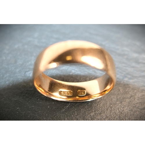 687 - A wide barrel shaped 9 ct hallmarked gold wedding ring, 4.4 gms, size 'P' - 'Q'.