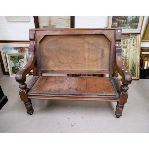 1003 - A Victorian stained wood bench seat with later panelling.