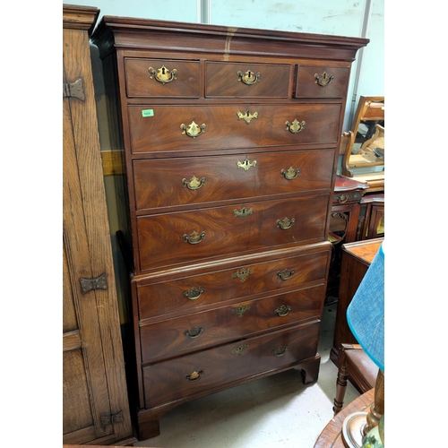 1025 - A Georgian mahogany chest on chest with three small drawers and six larger drawers, with brass fitti... 