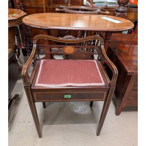 1037 - A Sheraton style inlaid mahogany piano stool with tapering legs.