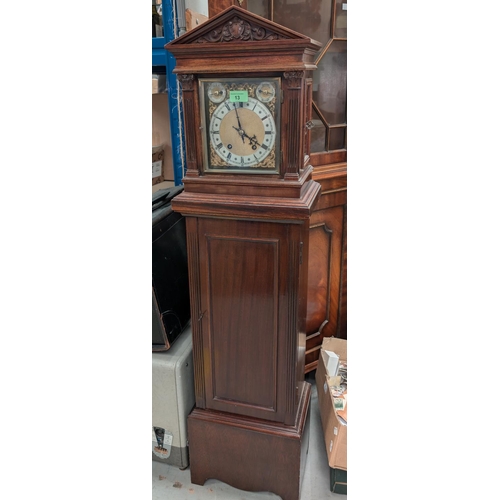 13 - An early 20th century mahogany cased mantel clock and pedestal stand with opening door.