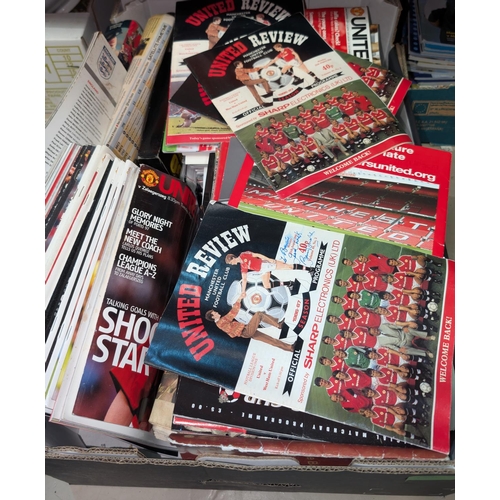 25B - A collection of Manchester United programmes, pictures etc, some with signatures.