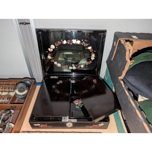 48 - A black lacquer box with internal divisions for game counters etc.