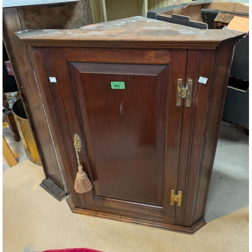 992 - An oak small stature panel front single door corner cupboard 72x59cms; a late 19th/early 2... 